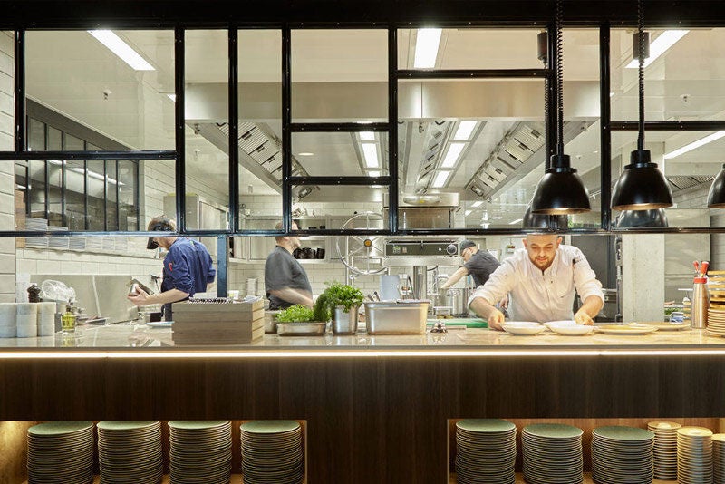 a group of people in a kitchen